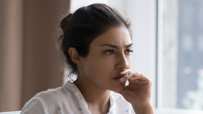 Young woman with an anxious expression