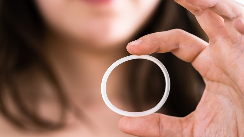 Person holding a birth control ring