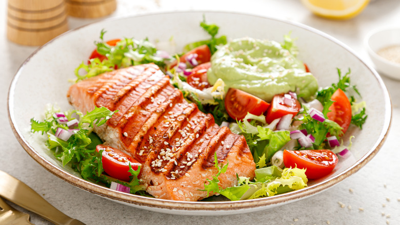 Plate of Salmon over Salad with Avocado Dip - Healthy Fats