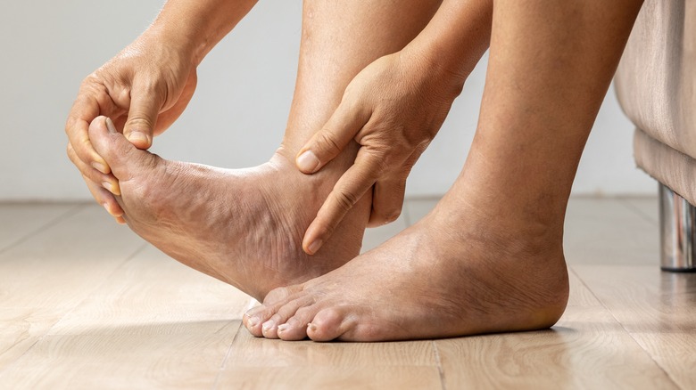Person stretching bare feet