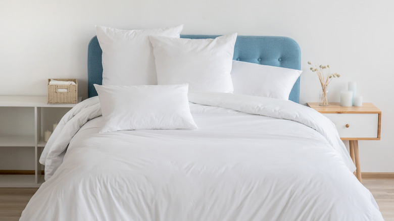 bed with extra pillows