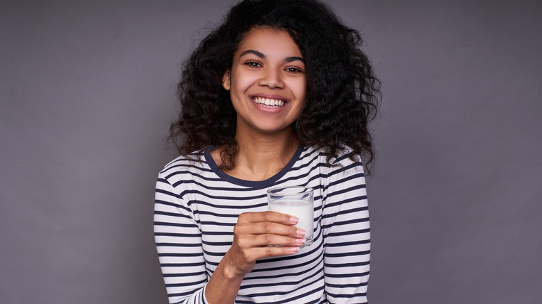 woman with glass of milk