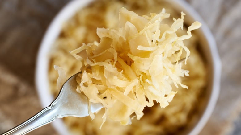 sauerkraut scooped out using fork