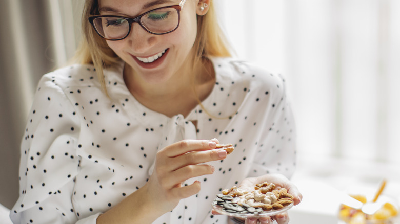 woman eating nuts