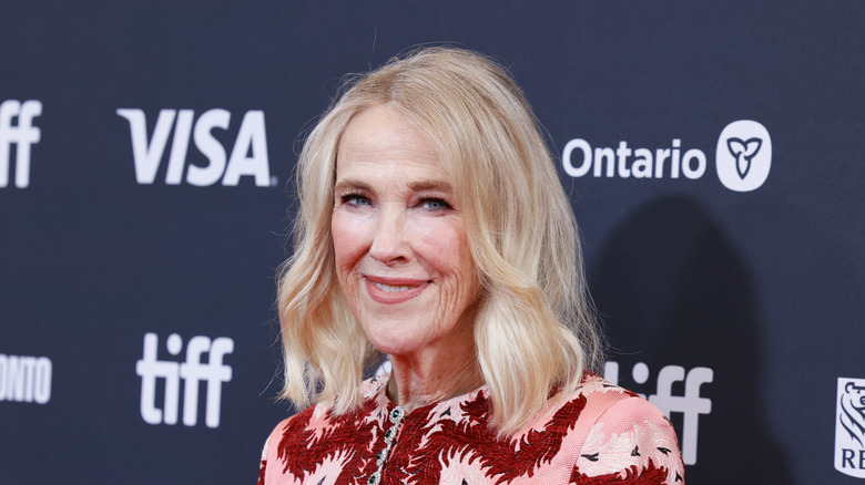 Catherine O'Hara in embellished pink and red jacket