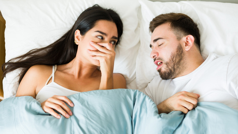Woman next to sleeping partner