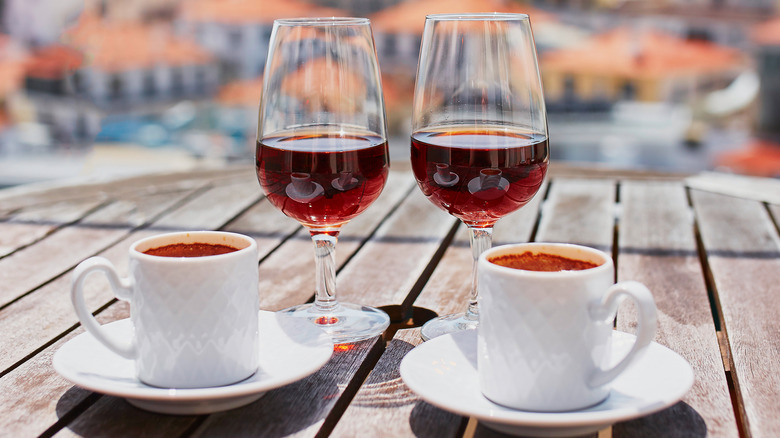 Two wine glasses and coffee mugs