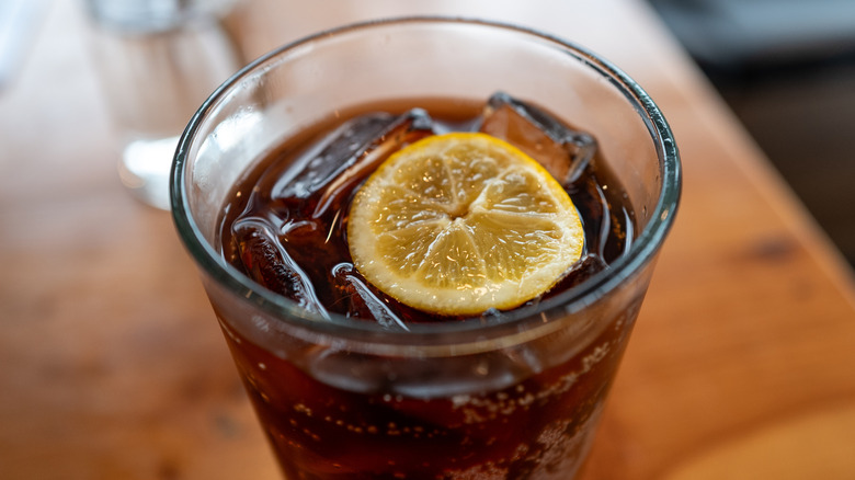 Close-up of a Diet Coca Cola (Diet Coke) soda with a lemon wedge floating in it at a restaurant