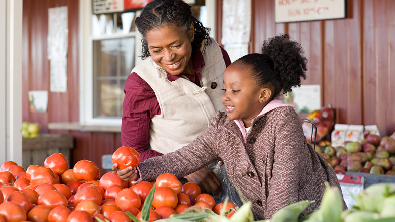 Mother and daughter at farm stand