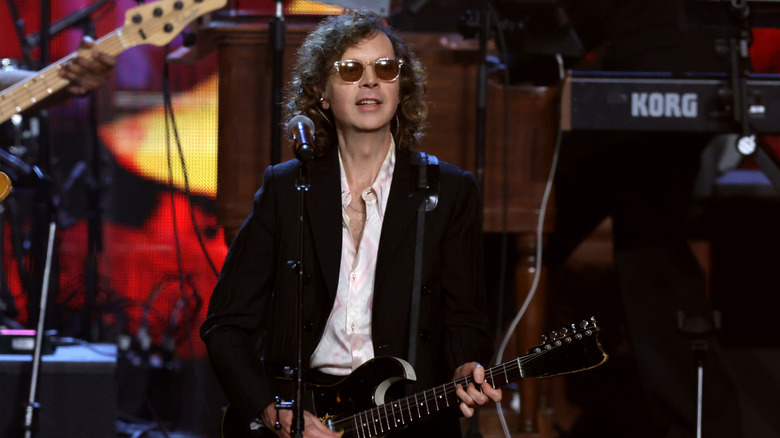 Beck playing guitar and performing