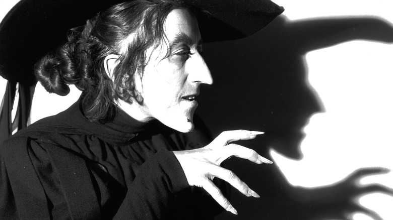 Margaret Hamilton as the Wicked Witch in black and white.