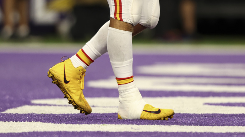 Shot of Travis Kelce's feet with an injured ankle in 2023