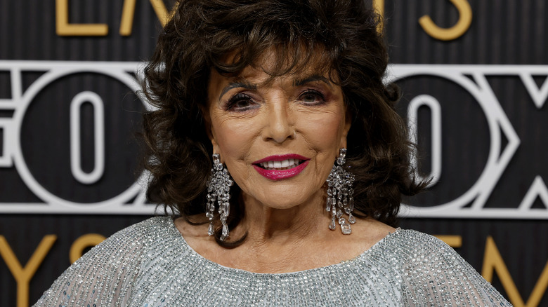 photo of Joan Collins smiling on the red carpet in 2024