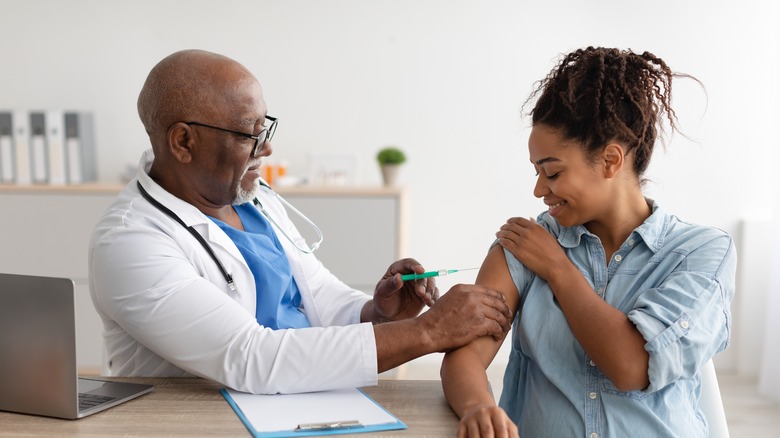 pregnant woman receiving a vaccine