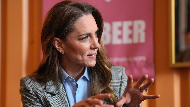 Britain's Catherine, Princess of Wales, gesturing as she speaks during a visit of Fabal Beerhall at the Bermondsey Beer Mile