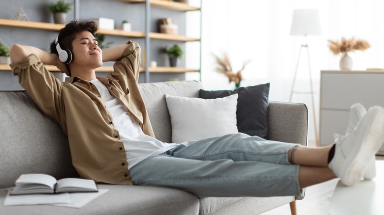 Smiling man relaxing with headphones