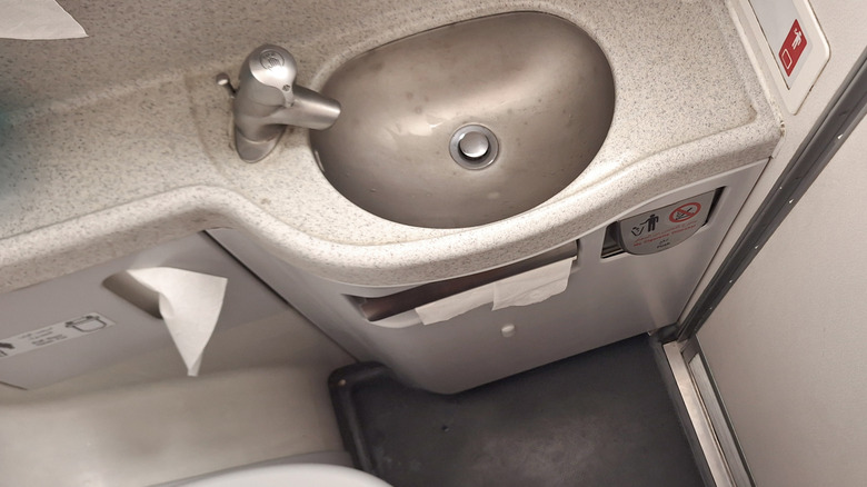 restroom facilities inside an airplane