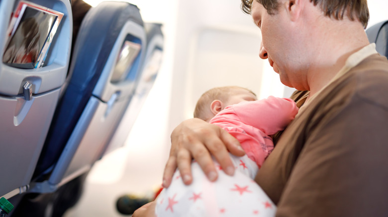 dad and baby on a plane