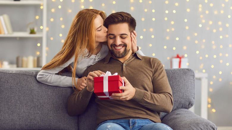 woman holding gift with ribbon