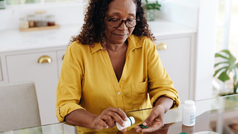 woman taking medication