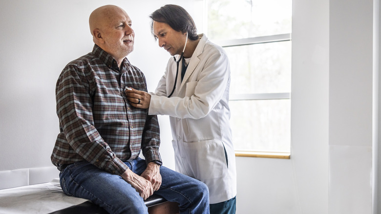 senior man with doctor