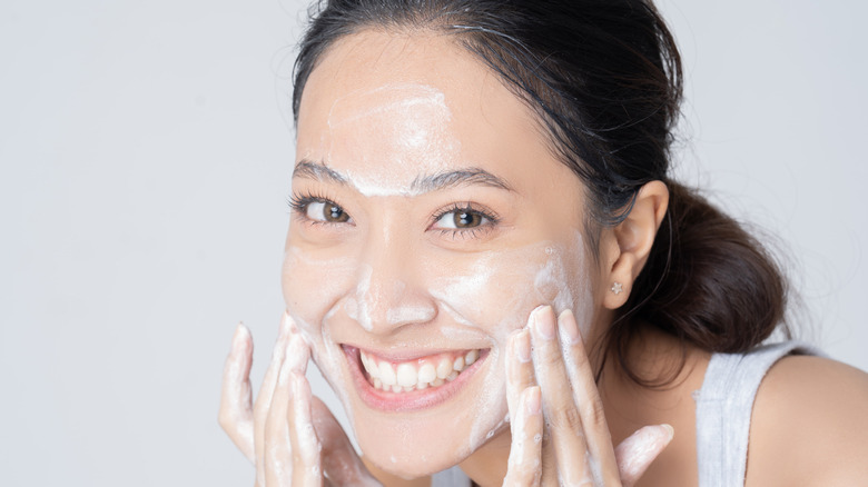 Woman washing face