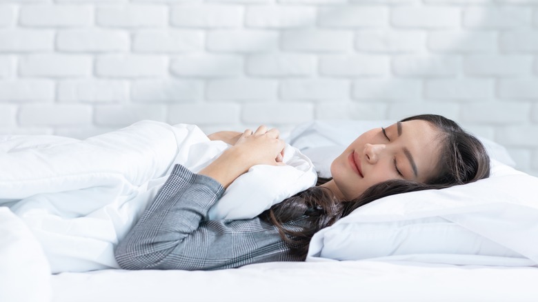 woman sleeping in her bed