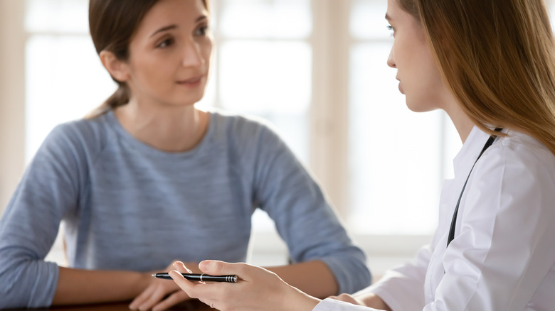 Doctor speaking to patient