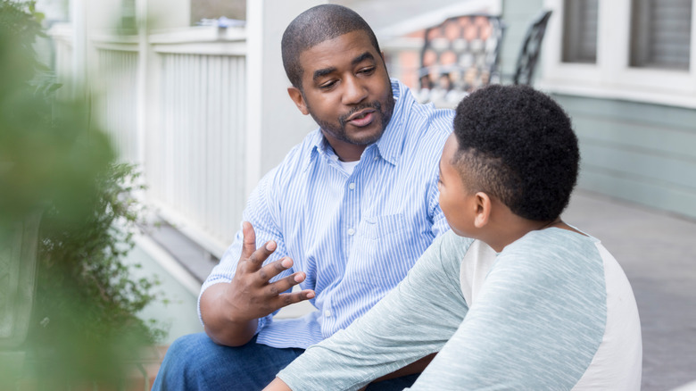 Son and father having a conversation