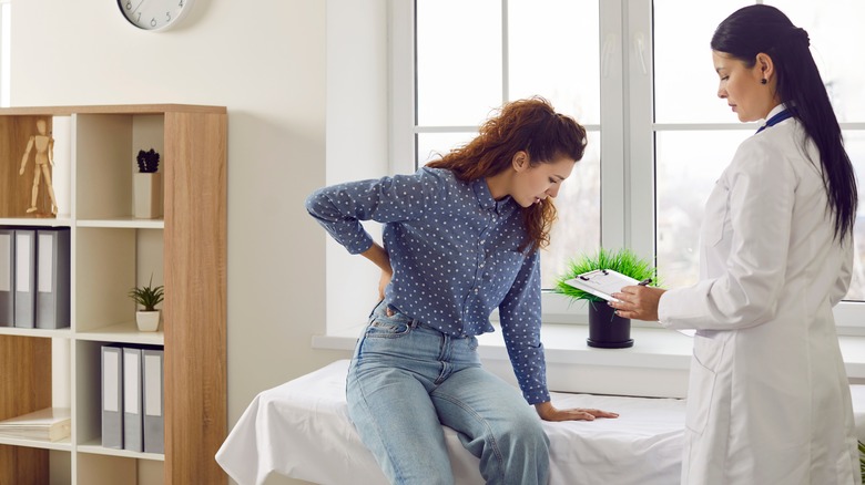Woman talking to doctor