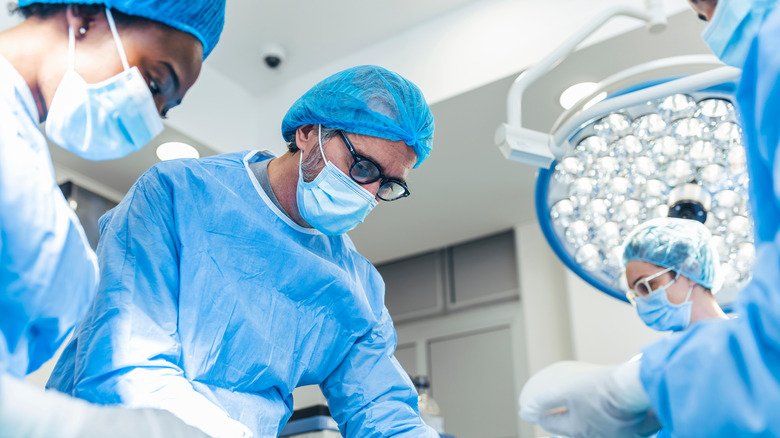 Plastic surgeons operating