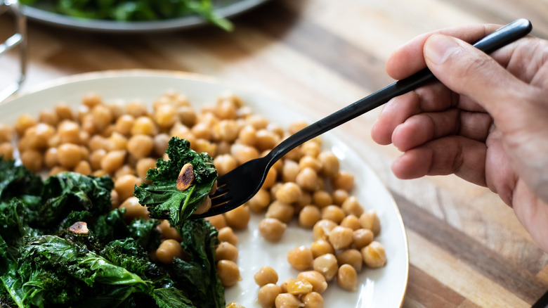 A plate of chickpeas and kale