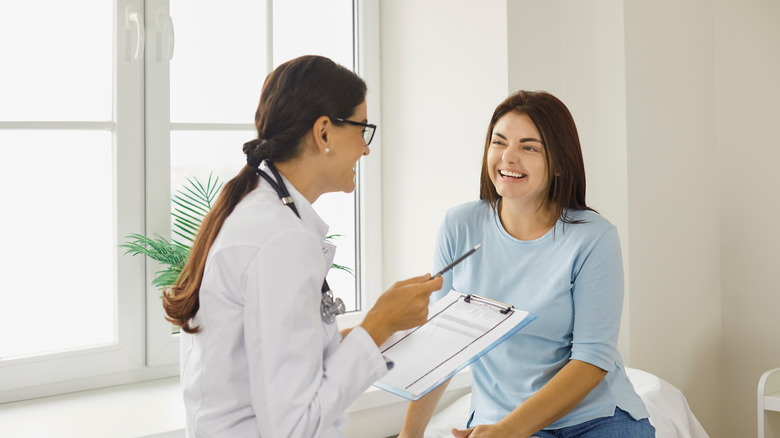 doctor consulting with woman