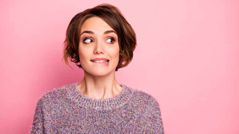 close up of a woman looking puzzled 