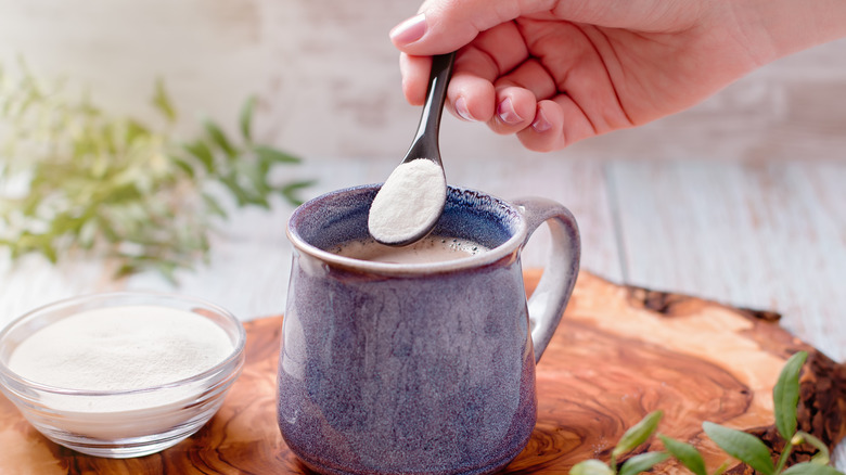 Someone puts powdered collagen in their coffee