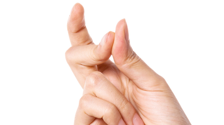 Hand with pinching fingers
