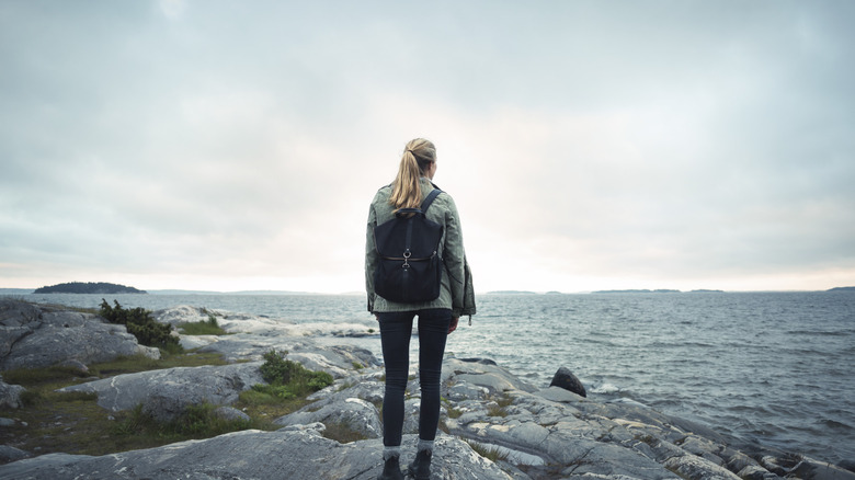 woman looking at ocean