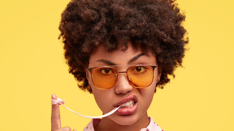 woman with gum on finger