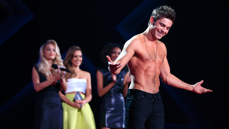Shirtless Zac Efron displaying toned torso