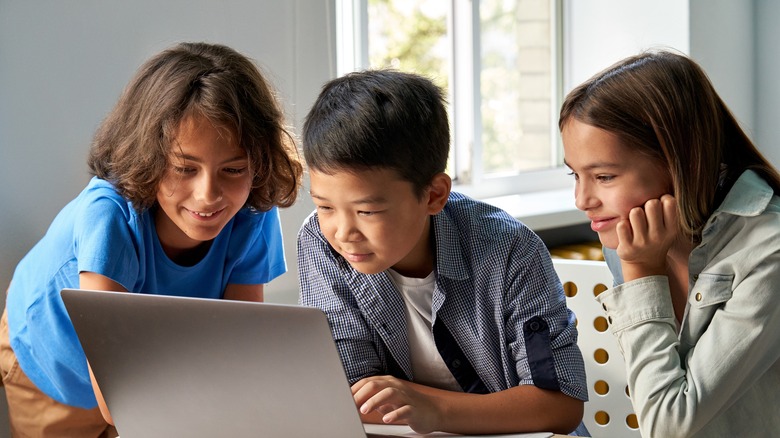 Children looking at a computer