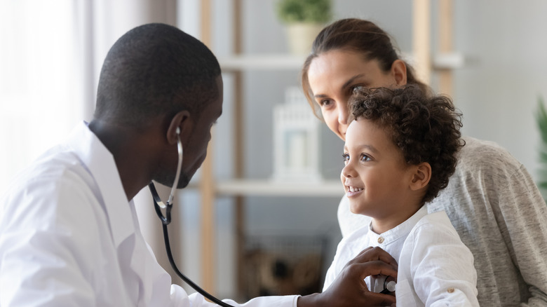 Child and mother visiting doctor