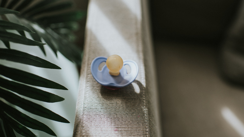 pacifier on window ledge