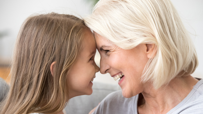 Woman and child touching noses