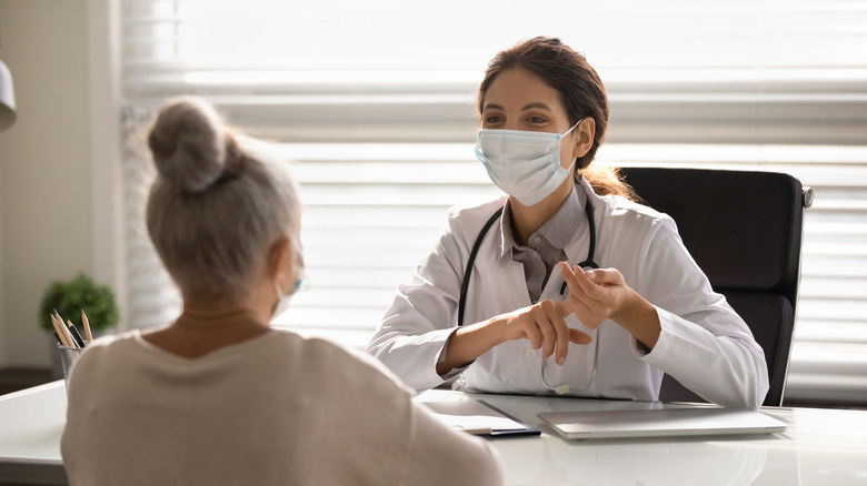 doctor treating patient