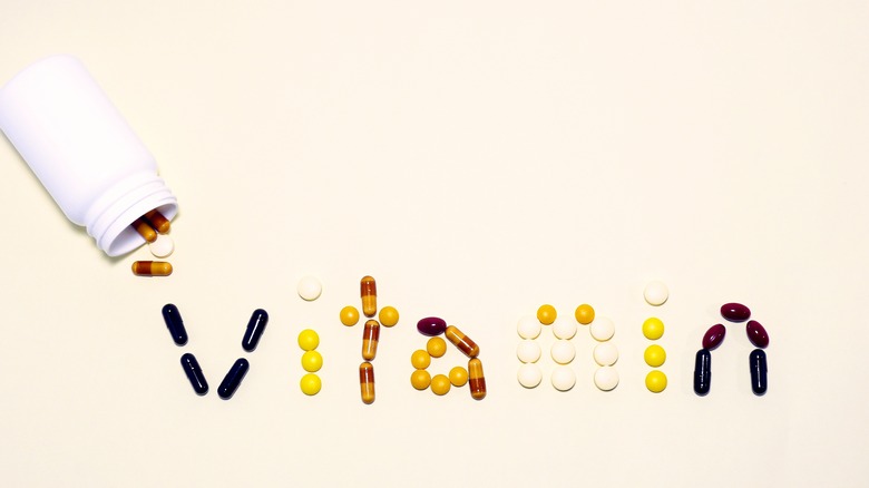 vitamin pills spelling out the word vitamin