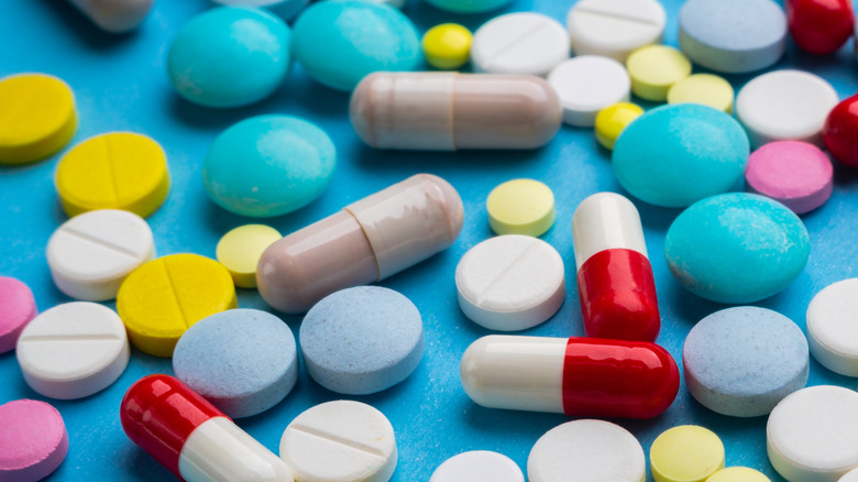 An array of pills on a blue background