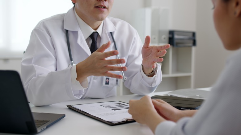 A woman talking with her doctor