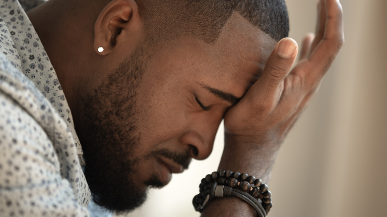 African American man grieving