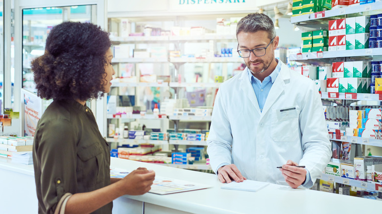 A woman talking to her pharmacist