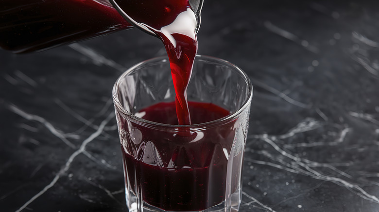 A glass of dark red cherry juice